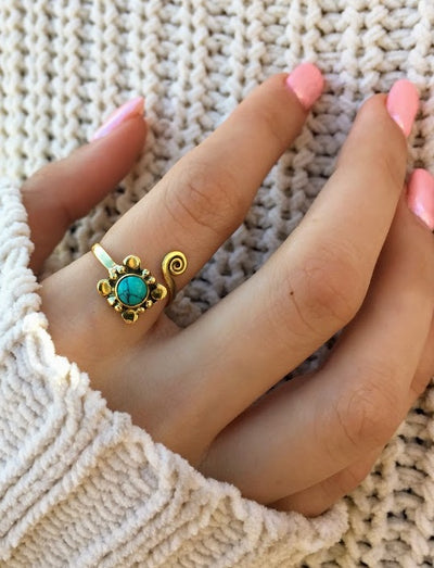 brass adjustable ring with turquoise stone.