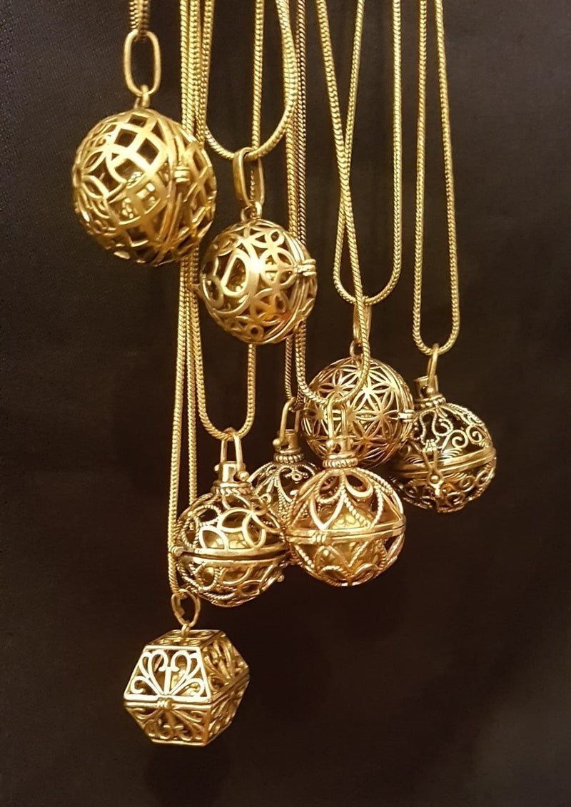 single balls brass with chain essential oils inside.